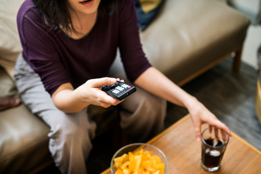 Woman Watching Television on the Sofa